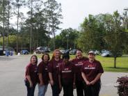Family and Friends Gathered Around for the Town Clean Up