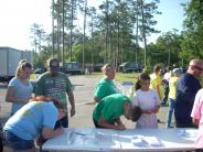 Friends and Family Gather Around for the Town Clean Up